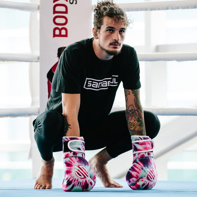 Sean O'Malley wearing Funk Strike Tie Dye boxing gloves